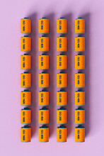 Orange Film Rolls On Pink Background