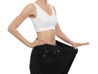 Sticker - Young woman wearing big jeans after weight loss on white background, closeup