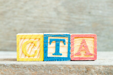 Color Alphabet Letter Block In Word CTA (Abbreviation Of Call To Action Or Chartered Tax Adviser) On Wood Background