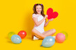 © deagreez - Full length body size photo schoolgirl at party with balloons smiling showing red heart isolated bright yellow color background