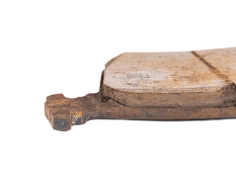 Old worn out brake pads from a car on a white background, isolate, close-up. Quality of friction linings, modern auto parts