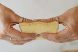 Fototapeta Tęcza - Female hands holding soft biscuit