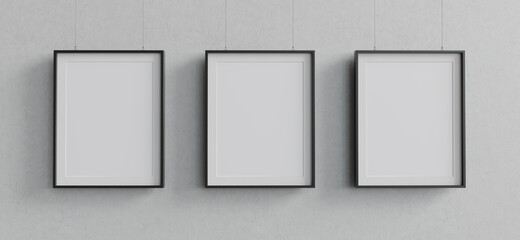 Three blank mockup posters hanging against concrete wall. 3D render. 3D image.
