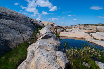 the beautiful coast of norway with its rock formations and blue water on a beautiful summer day