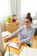 © Mihajlo Ckovric/Stocksy - Young woman studying at home