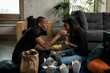 © Sean Locke/Stocksy - Loft: Friends Share Egg Drop Soup And Other Chinese Dishes