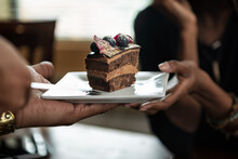 Loft: Friends Celebrating Birthday With Chocolate Cake