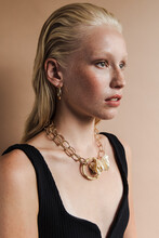 Young Model Wearing Earrings And Necklace
