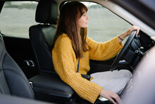 A Woman Driving A Car
