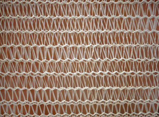 Close up White plastic handmade woven net decorating wall