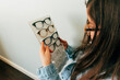 © Jessica Klaus/Stocksy - Finding new eyeglasses.