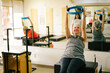 © THEFUNKSHIP/Stocksy - Senior Pilates Reformer Class