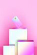 © Pixel Stories/Stocksy - Iridescent debit card on product display podium