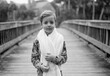 © Jakob Lagerstedt/Stocksy - Black and white portrait of a young boy with a towel around him