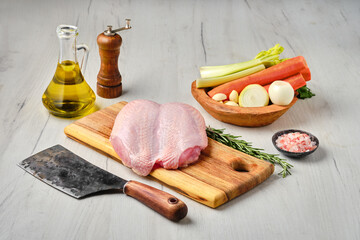 Wall Mural - Raw whole chicken breast with skin on carcas with ingredients for cooking