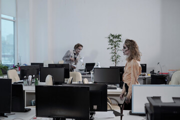 Poster - Zombie female moving along rows of desks in open space office