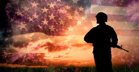 Wall Mural - Composition of silhouette of soldier against sunset sky and billowing american flag