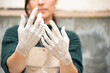 © Malquerida Studio/Stocksy - Close up of ceramist's hands dirty of clay