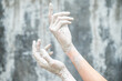 © Malquerida Studio/Stocksy - Close up of ceramist's hands dirty of clay