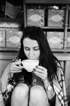  A Portrait Of A Beautiful Woman Drinking A Tea