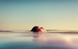 © Ibai Acevedo/Stocksy - Side view from a floating girl in the sea