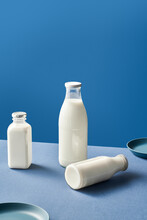 Bottles Of Dairy Near Plates