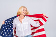 © denis_vermenko - Smiling senior beautiful patriotic woman wearing united states flag isolated over white background with a surprise face.