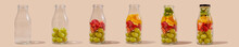 Filling Glass Bottles With Fruit
