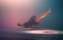 Underwater Portrait Of An Upside Down Girl 
