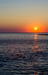 Wall Mural - Amazing sea sunset, the sun, waves, clouds
