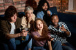 © alfa27 - Interracial Group Of Friends Discuss Which Movie To Watch, Sitting On Sofa At Home, Choosing The Most Interesting Film, Relaxed Guys And Ladies Have Talk, Switch Channels On TV