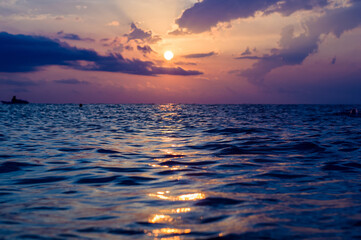 Wall Mural - Amazing sea sunset, the sun, waves, clouds