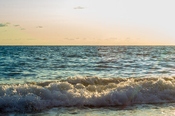 Wall Mural - Amazing sea sunset, the sun, waves, clouds