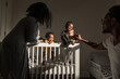 © Alison Winterroth/Stocksy - Dad and Mom entertain children