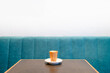 © Nadine Brandt/Stocksy - Single small cortado coffee on the table