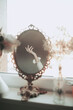 © Jovana Rikalo/Stocksy - Female hand in a mirror