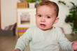 © Guille Faingold/Stocksy - Sadly crying baby boy discomposedly frowning.