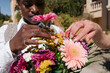 © Lucas Ottone/Stocksy - Flowers and colorful nails