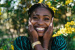 © Lucas Ottone/Stocksy - Cheerful African Woman