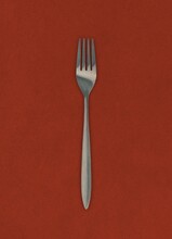 fork on red background