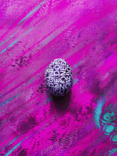 Custom Made Easter Egg On Violet Abstract Background With Copyspace