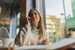 © Javier Pardina/Stocksy - Woman speaking with customers by phone