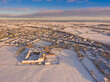 Aerial view of snow covered rural village