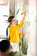 © Santi Nuñez/Stocksy - Businesswoman Putting Post-It Notes On Glass Board