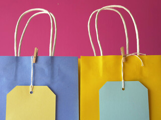 Poster - Gift bags and labels on pink background