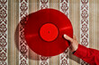 © Juan Moyano/Stocksy - man has a red disc in his hand
