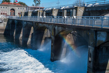 Hiram M. Chittenden Locks, Seattle Washington On A Sunny Spring Day With Clear Blue Sky And With A Rainbow.