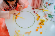 Asian Kid Making Dried Flower Fan Decoration DIY