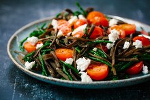Seaweed Noodles With Tomatoes, Feta Cheese And Samphire.
