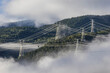 © Wenhai Tang/Stocksy - Green energy sources transmission tower